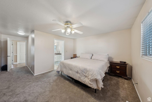 518 E Wendy Way S, Tremonton, UT 84337 - bedroom featuring carpet floors, baseboards, ensuite bathroom, and a ceiling fan