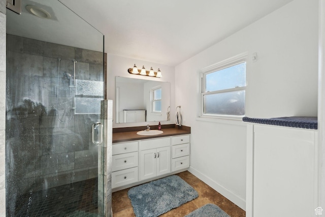 518 E Wendy Way S, Tremonton, UT 84337 - full bathroom with vanity, tile patterned flooring, baseboards, and a stall shower