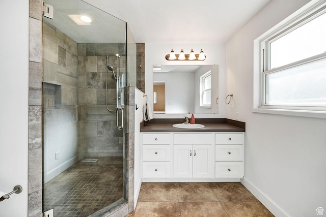 518 E Wendy Way S, Tremonton, UT 84337 - bathroom with vanity, baseboards, a stall shower, and tile patterned floors