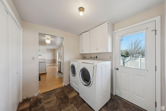 518 E Wendy Way S, Tremonton, UT 84337 - clothes washing area with separate washer and dryer, stone finish flooring, cabinet space, and baseboards