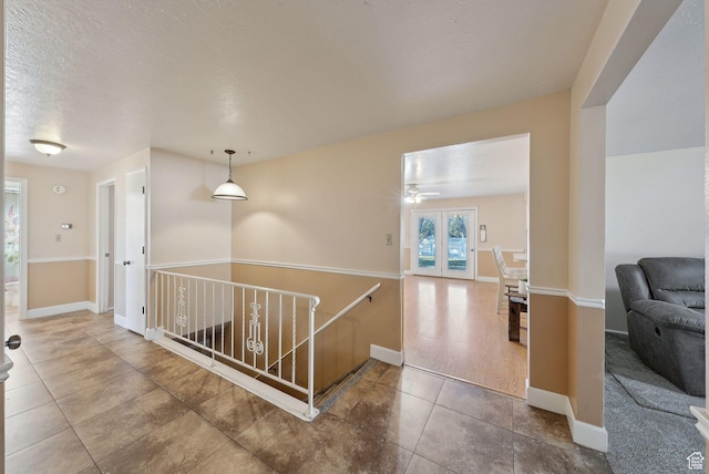 518 E Wendy Way S, Tremonton, UT 84337 - hall with tile patterned floors, baseboards, and an upstairs landing