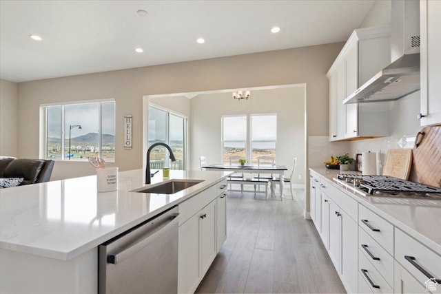 304 E Empire Springs Dr, Saratoga Springs, UT 84045 - kitchen featuring a sink, stainless steel appliances, wall chimney exhaust hood, light countertops, and recessed lighting