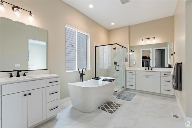 304 E Empire Springs Dr, Saratoga Springs, UT 84045 - full bath featuring marble finish floors, a stall shower, a freestanding tub, two vanities, and baseboards
