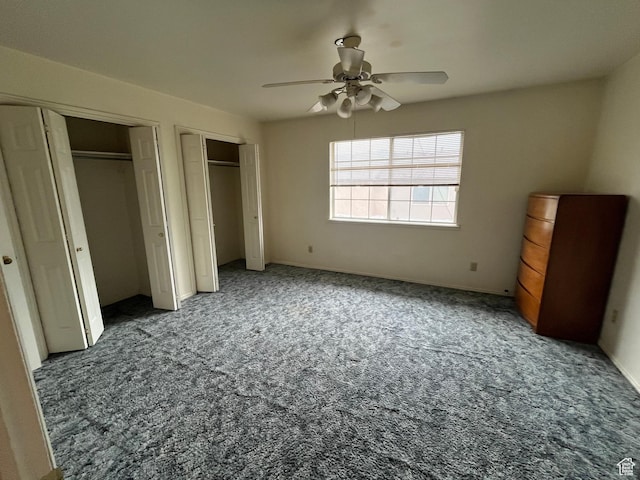 99 N 1850 W Unit 4, Cedar City, UT 84720 - unfurnished bedroom featuring a ceiling fan, carpet, and two closets