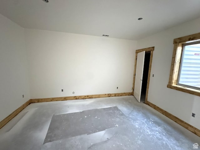 3042 S Chukar Dr, Garden City, UT 84028 - spare room featuring baseboards and unfinished concrete flooring