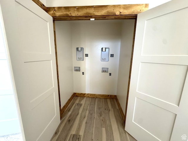 3042 S Chukar Dr, Garden City, UT 84028 - washroom featuring hookup for an electric dryer, laundry area, baseboards, light wood finished floors, and hookup for a washing machine
