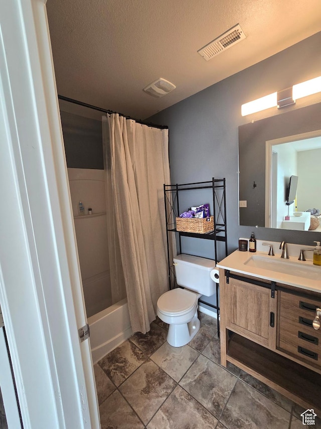 full bath with shower / bath combination with curtain, toilet, a textured ceiling, visible vents, and vanity