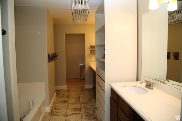 3596 W 2610 S, Syracuse, UT 84075 - full bath with vanity, a garden tub, a chandelier, and baseboards