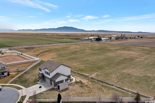 birds eye view of property with a mountain view and a rural view