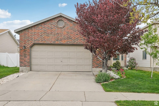 8564 S Laurel Oak Dr W, West Jordan, UT 84088 - view of front of home with brick siding, driveway, and an attached garage