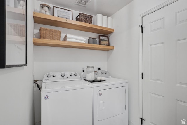 washroom with independent washer and dryer