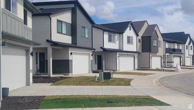 view of front of house featuring a residential view, a garage, concrete driveway, a shingled roof, and stucco siding