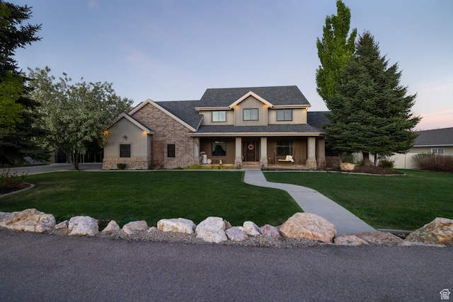 486 N 3500 W, Vernal, UT 84078 - view of front of house with a porch, a front yard, and stone siding
