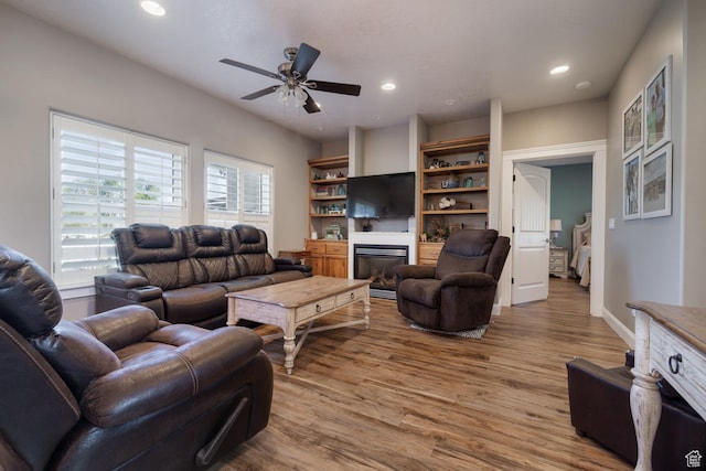486 N 3500 W, Vernal, UT 84078 - living room with a ceiling fan, wood finished floors, baseboards, a glass covered fireplace, and recessed lighting