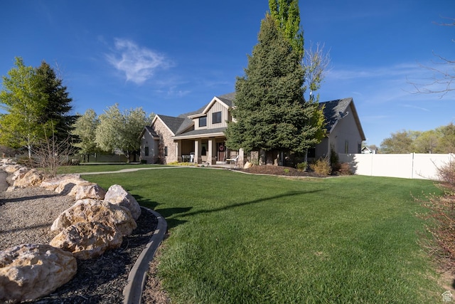 486 N 3500 W, Vernal, UT 84078 - view of front of property featuring fence, covered porch, and a front lawn