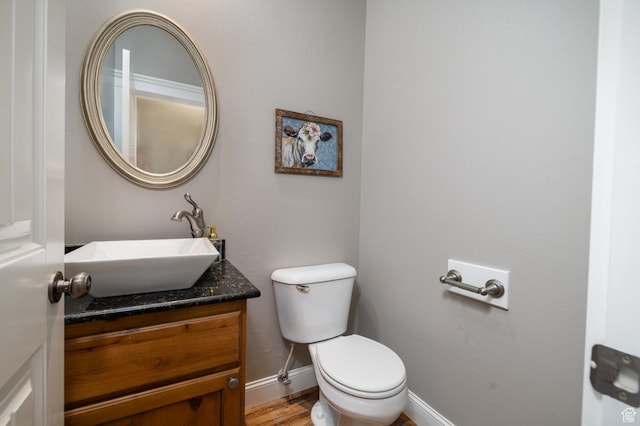 486 N 3500 W, Vernal, UT 84078 - half bath featuring vanity, baseboards, toilet, and wood finished floors