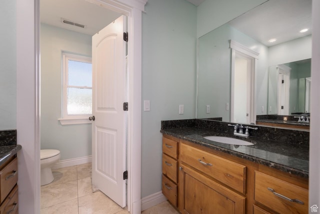 486 N 3500 W, Vernal, UT 84078 - bathroom featuring visible vents, vanity, baseboards, tile patterned floors, and toilet