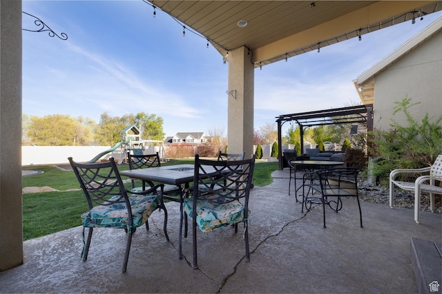 486 N 3500 W, Vernal, UT 84078 - view of patio featuring a fenced backyard, a playground, a pergola, and outdoor dining space