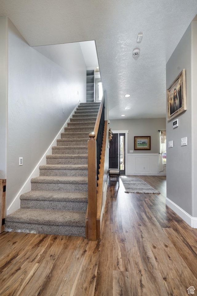 486 N 3500 W, Vernal, UT 84078 - stairway featuring a textured ceiling and wood finished floors