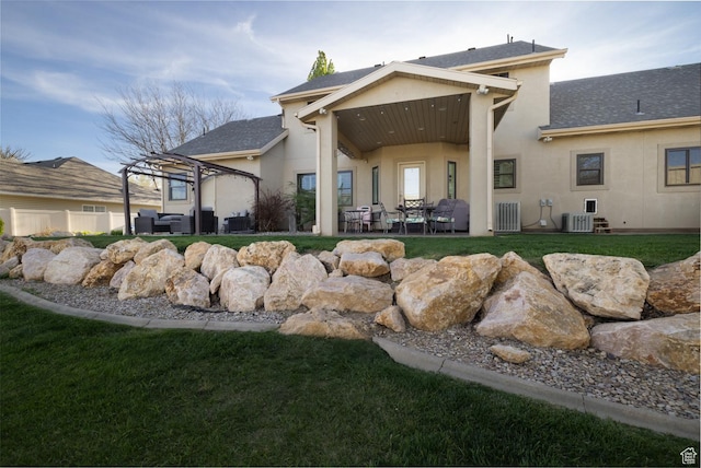 486 N 3500 W, Vernal, UT 84078 - rear view of property with a lawn, central AC, a patio area, and stucco siding