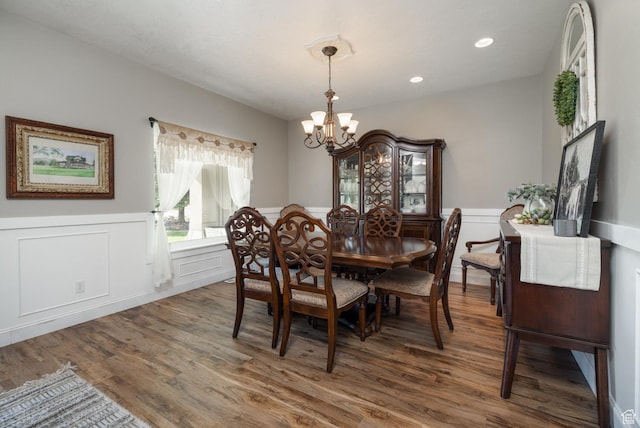 486 N 3500 W, Vernal, UT 84078 - dining space with an inviting chandelier, wainscoting, a decorative wall, and wood finished floors