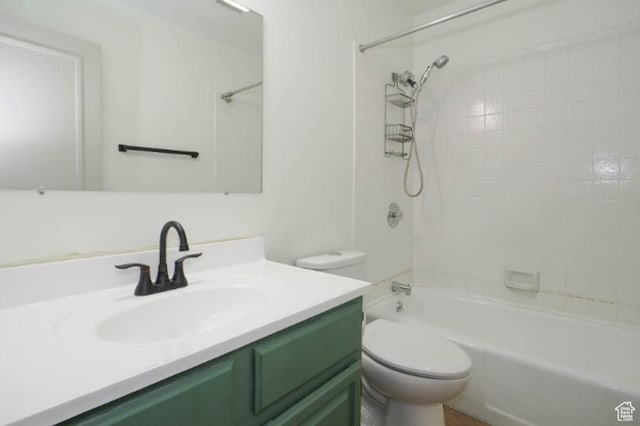 bathroom with toilet, shower / bath combination, and vanity