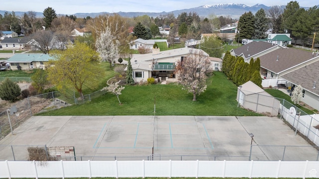 drone / aerial view featuring a mountain view and a residential view