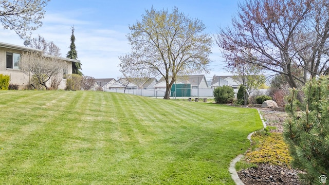 view of yard with a residential view and fence