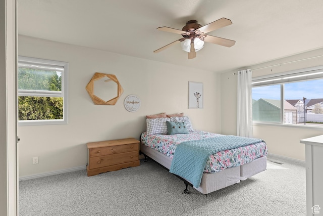 bedroom featuring baseboards, carpet flooring, ceiling fan, and visible vents
