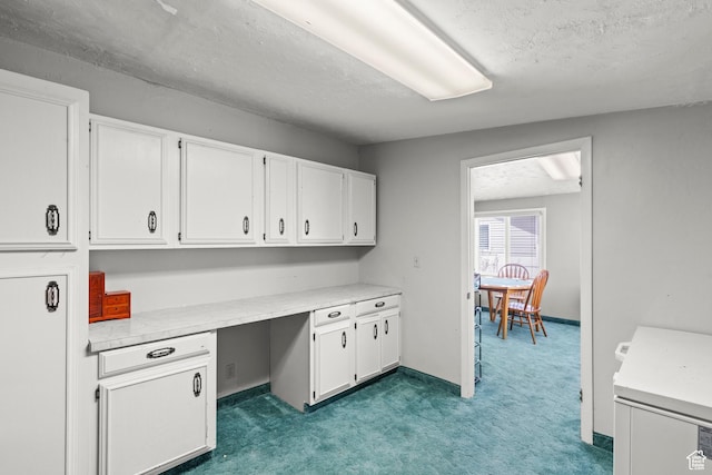 unfurnished office with a textured ceiling and carpet