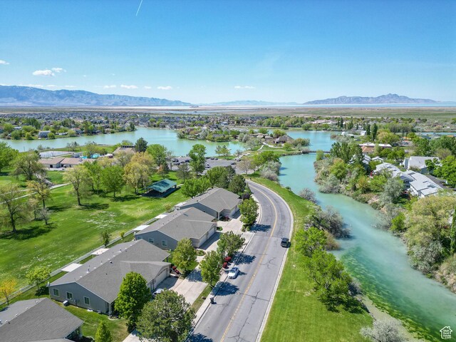 25 Clubhouse Dr, Stansbury Park, UT 84074 - drone / aerial view featuring a water and mountain view and a residential view