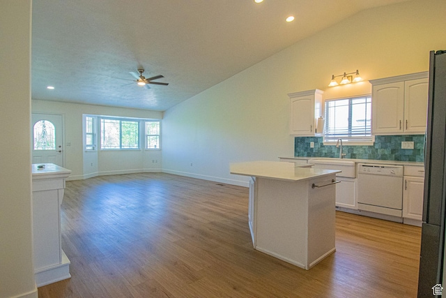 25 Clubhouse Dr, Stansbury Park, UT 84074 - kitchen featuring white dishwasher, ceiling fan, tasteful backsplash, and lofted ceiling
