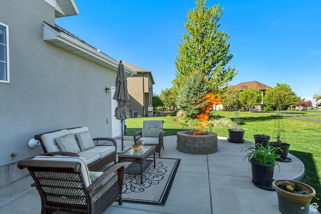 view of patio / terrace featuring an outdoor living space with a fire pit
