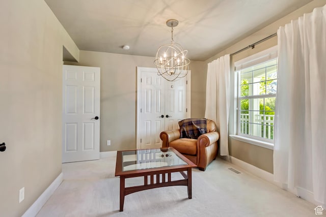 living area featuring visible vents, carpet flooring, baseboards, and a chandelier