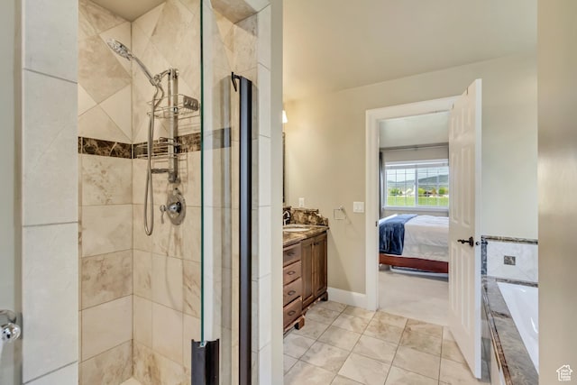 full bath with tile patterned flooring, vanity, a shower stall, ensuite bathroom, and a bath