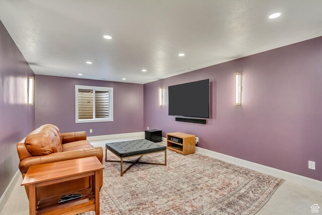 living room featuring recessed lighting, baseboards, and carpet