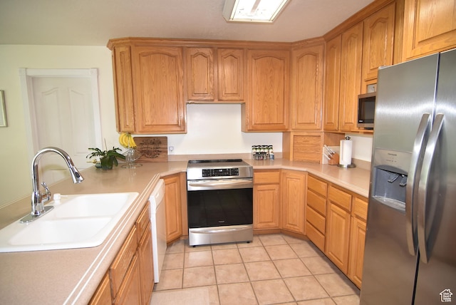183 E Ama Fille Ln N, Elk Ridge, UT 84651 - kitchen featuring appliances with stainless steel finishes, a sink, light countertops, light tile patterned floors, and a peninsula