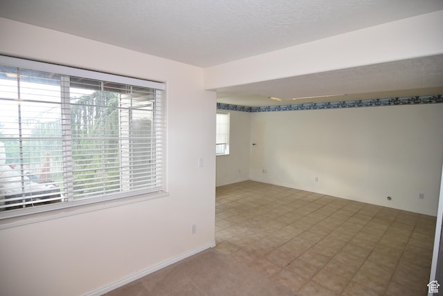 183 E Ama Fille Ln N, Elk Ridge, UT 84651 - empty room featuring healthy amount of natural light and baseboards