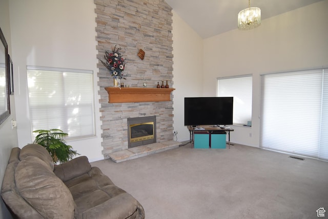 183 E Ama Fille Ln N, Elk Ridge, UT 84651 - carpeted living area with high vaulted ceiling, a fireplace, and a chandelier