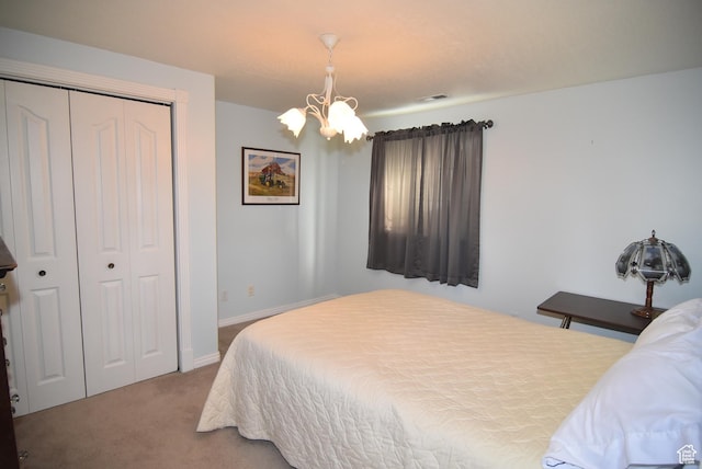 183 E Ama Fille Ln N, Elk Ridge, UT 84651 - bedroom with a chandelier, carpet floors, a closet, and baseboards