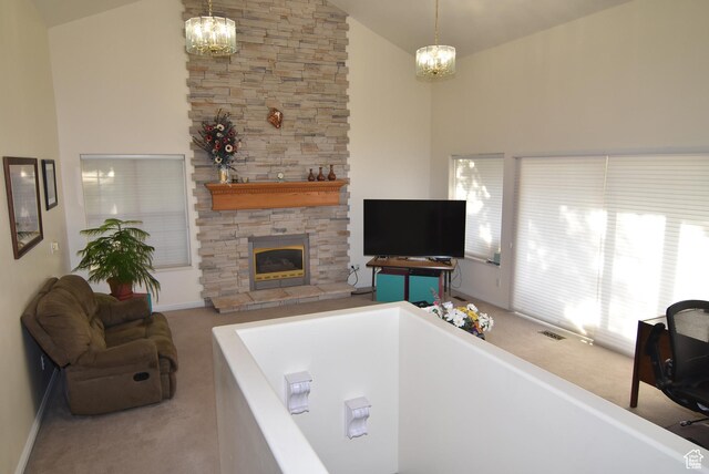 183 E Ama Fille Ln N, Elk Ridge, UT 84651 - living area featuring a chandelier, carpet flooring, a stone fireplace, high vaulted ceiling, and baseboards