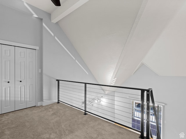 additional living space featuring lofted ceiling and carpet
