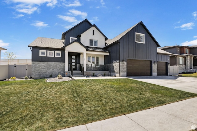 423 W Red Wolf Dr, Saratoga Springs, UT 84045 - modern farmhouse style home featuring board and batten siding, stone siding, a front yard, and a gate