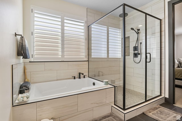 423 W Red Wolf Dr, Saratoga Springs, UT 84045 - full bathroom featuring a bath, a shower stall, and a healthy amount of sunlight