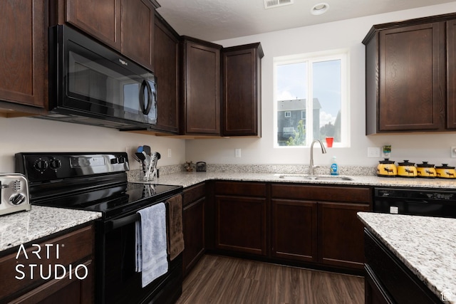 2034 E 970 N, Spanish Fork, UT 84660 - kitchen with black appliances, a sink, dark wood finished floors, dark brown cabinetry, and light stone counters