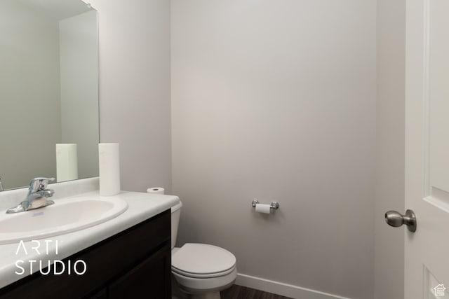 2034 E 970 N, Spanish Fork, UT 84660 - half bath with vanity, toilet, wood finished floors, and baseboards