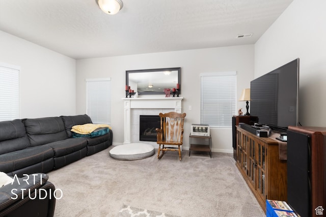 2034 E 970 N, Spanish Fork, UT 84660 - carpeted living area with a tiled fireplace and baseboards
