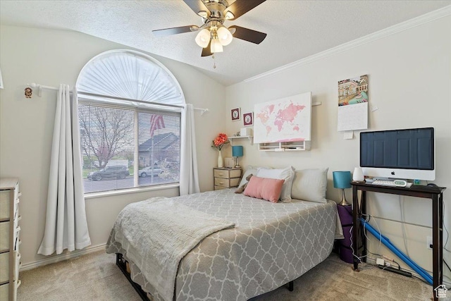 bedroom with a textured ceiling, baseboards, ornamental molding, ceiling fan, and carpet floors