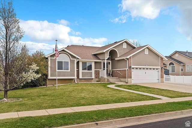 view of front of home featuring fence, brick siding, a garage, stucco siding, and a front lawn