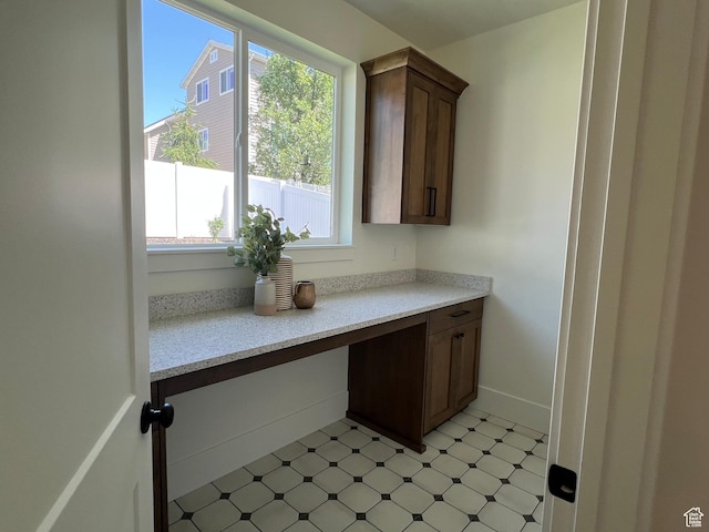 1148 N 1875 E Unit 2, Layton, UT 84040 - kitchen featuring healthy amount of natural light, light flooring, and light stone countertops